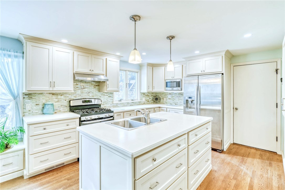 947 Copper Kettle Road Webster, NY 14580 - Photo 12 of 49 Large Island with storage. Solid surface counters