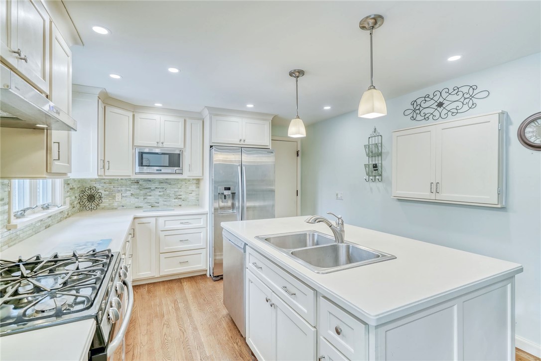 947 Copper Kettle Road Webster, NY 14580 - Photo 13 of 49 Updated Kitchen with Solid surface counters and ti