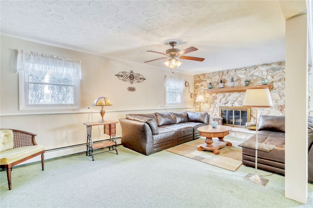 947 Copper Kettle Road Webster, NY 14580 - Photo 16 of 49 Spacious Family Room with Stone wood burning firep