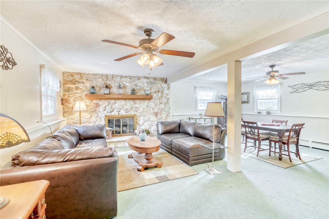 947 Copper Kettle Road Webster, NY 14580 - Photo 17 of 49 Spacious Family Room with stone wood burning firep