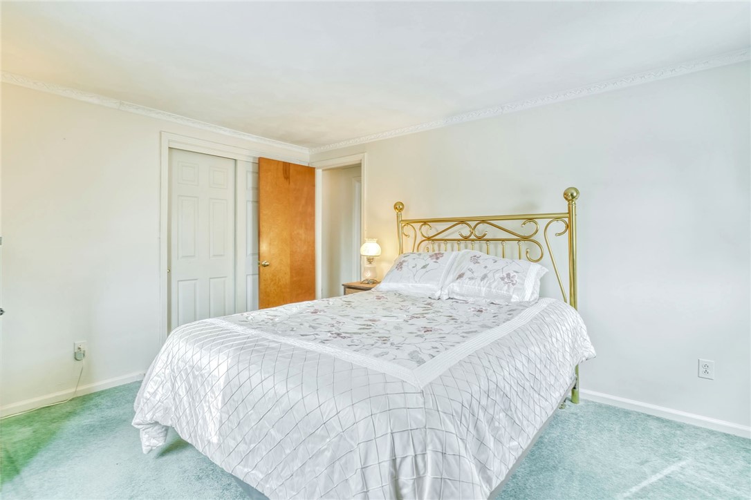 947 Copper Kettle Road Webster, NY 14580 - Photo 32 of 49 Primary Bedroom with hardwood floors under the car