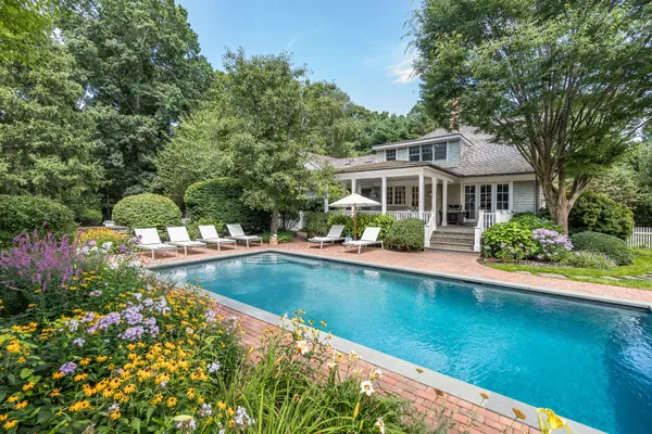 a front view of a house with swimming pool