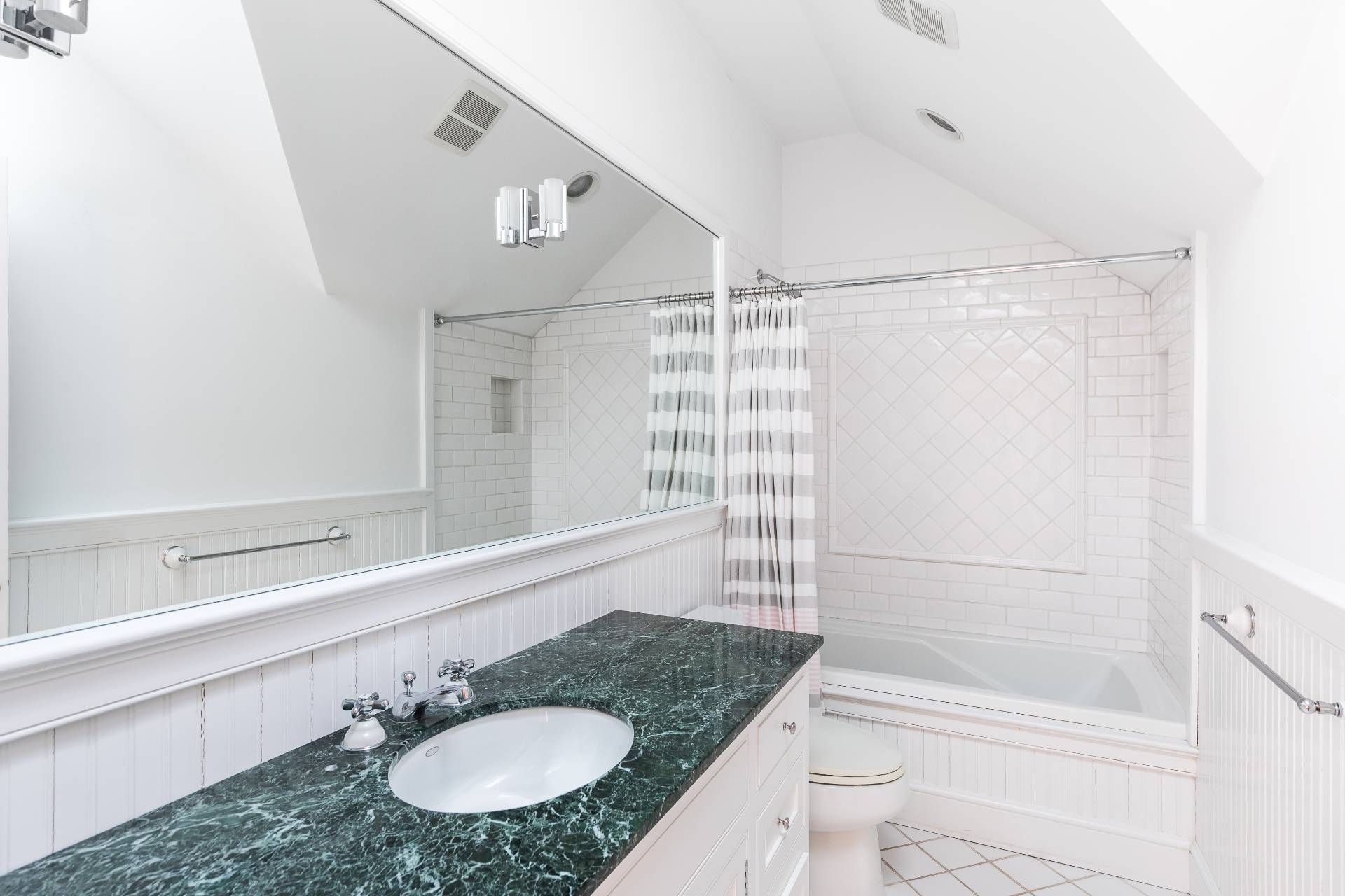 5 Mill Path Bridgehampton, NY 11963 - Photo 23 of 31 a bathroom with a granite countertop sink and a mirror
