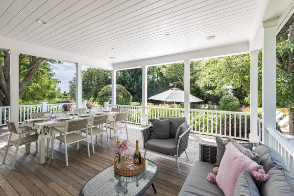a view of a patio with couches chairs dining table and chairs