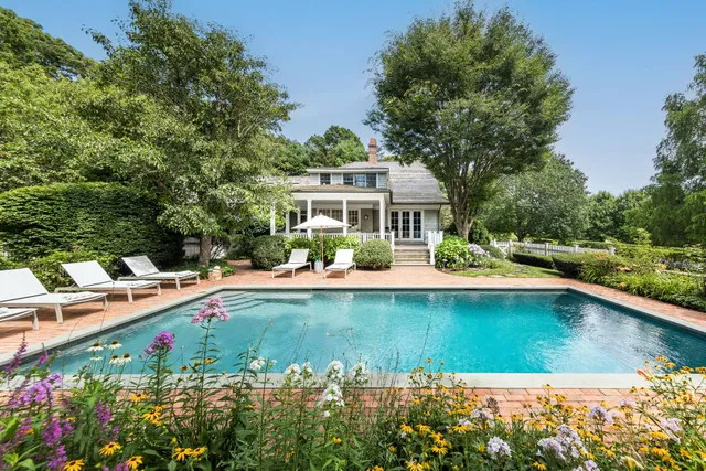 a view of a swimming pool with lounge chair