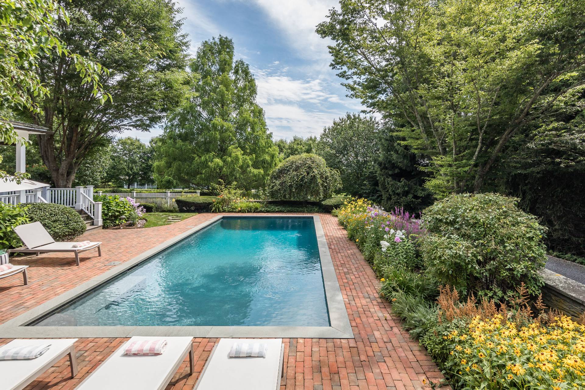 5 Mill Path Bridgehampton, NY 11963 - Photo 28 of 31 a view of a swimming pool with an outdoor seating