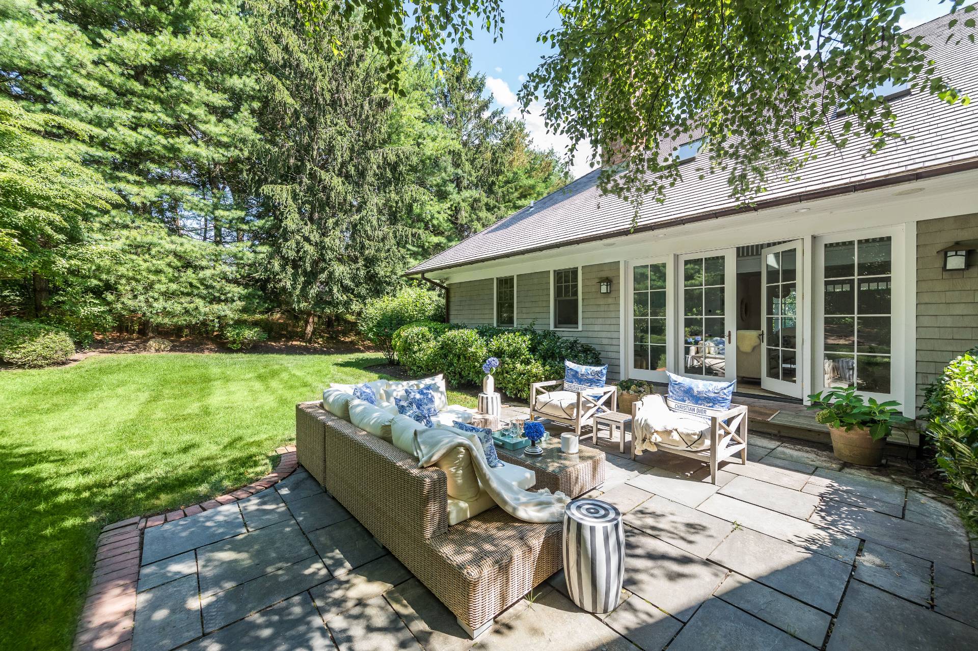 5 Mill Path Bridgehampton, NY 11963 - Photo 29 of 31 a view of a patio with couches table and chairs with plants and garden