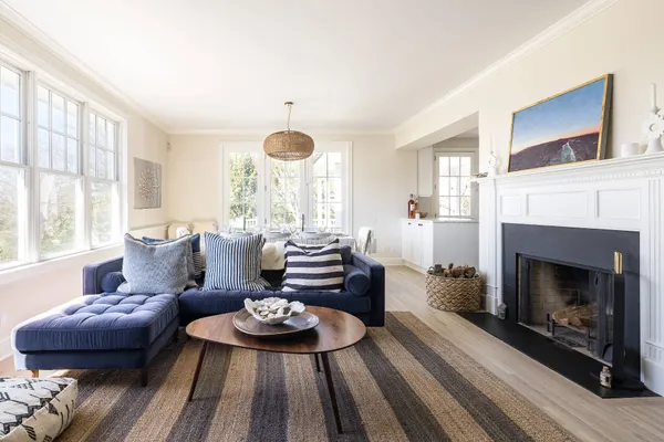 a living room with furniture and a fireplace