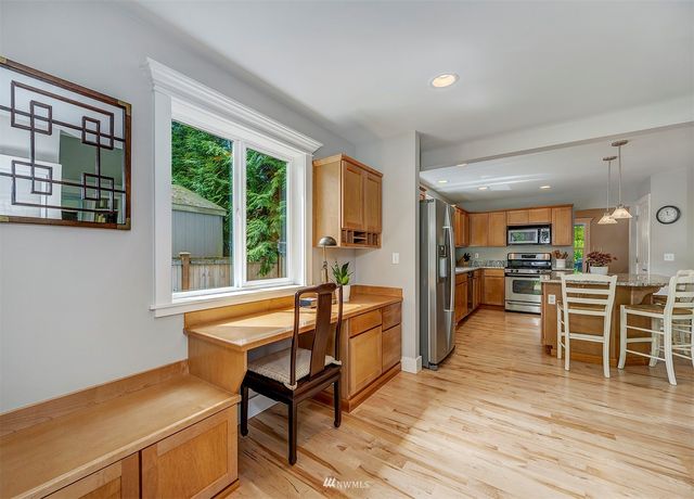 a outdoor space with a large window and furniture