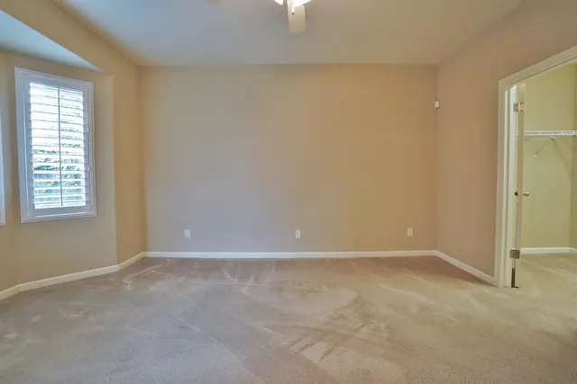 a bathroom with a double vanity sink toilet and shower