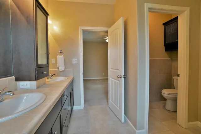 a view of a kitchen with a sink and cabinets