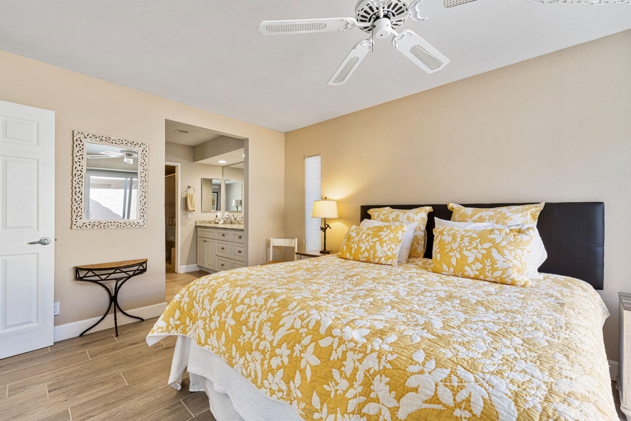 49091 Taylor Street Indio, CA 92201 - Photo 20 of 49 a bedroom with a bed and a chandelier
