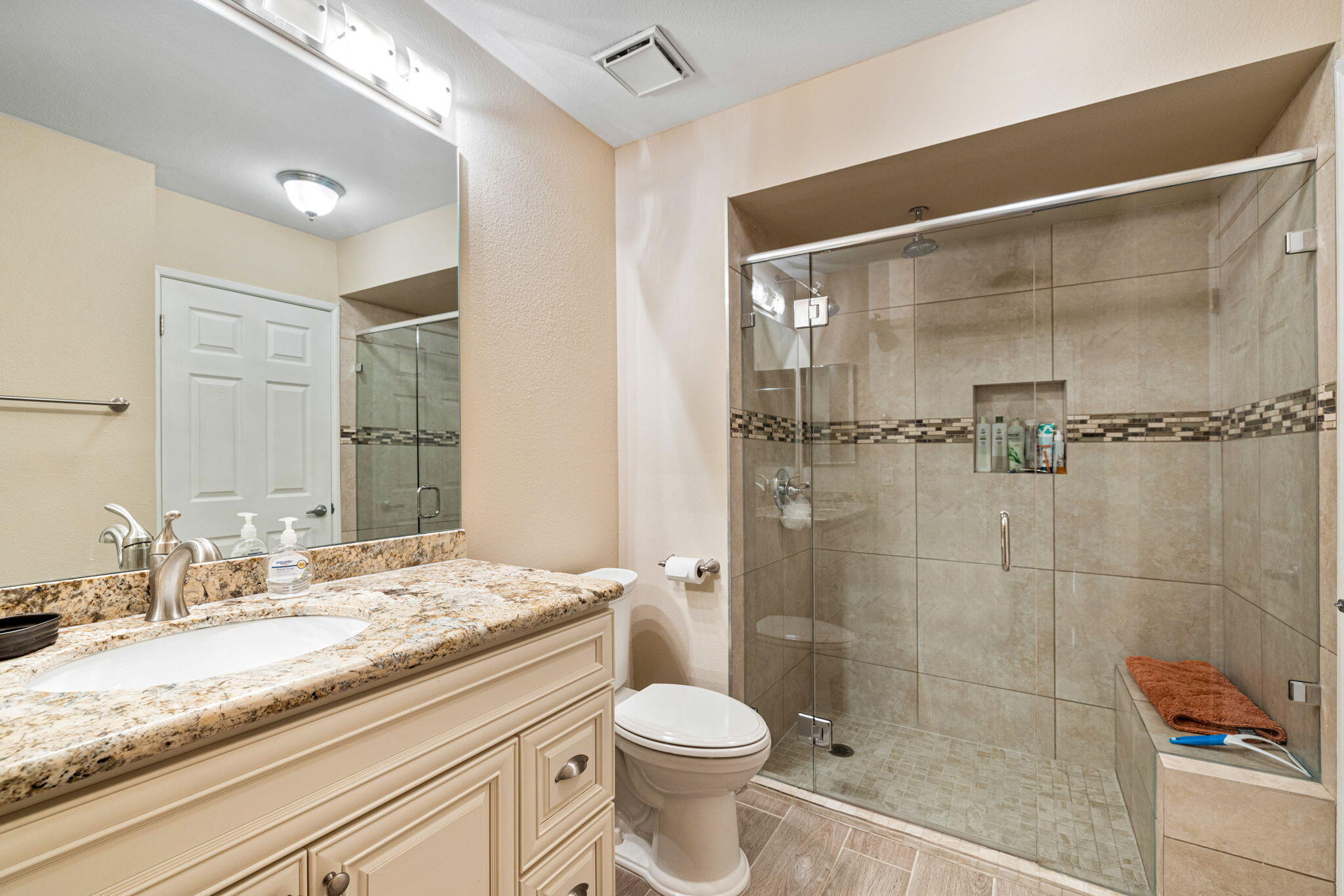 49091 Taylor Street Indio, CA 92201 - Photo 22 of 49 a bathroom with a granite countertop sink toilet and shower