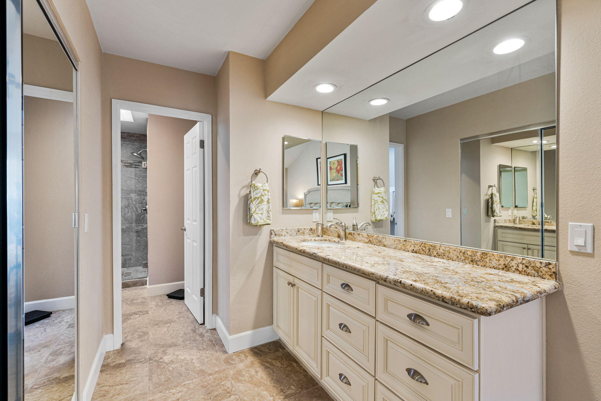 49091 Taylor Street Indio, CA 92201 - Photo 23 of 49 a bathroom with a granite countertop sink mirror and cabinets