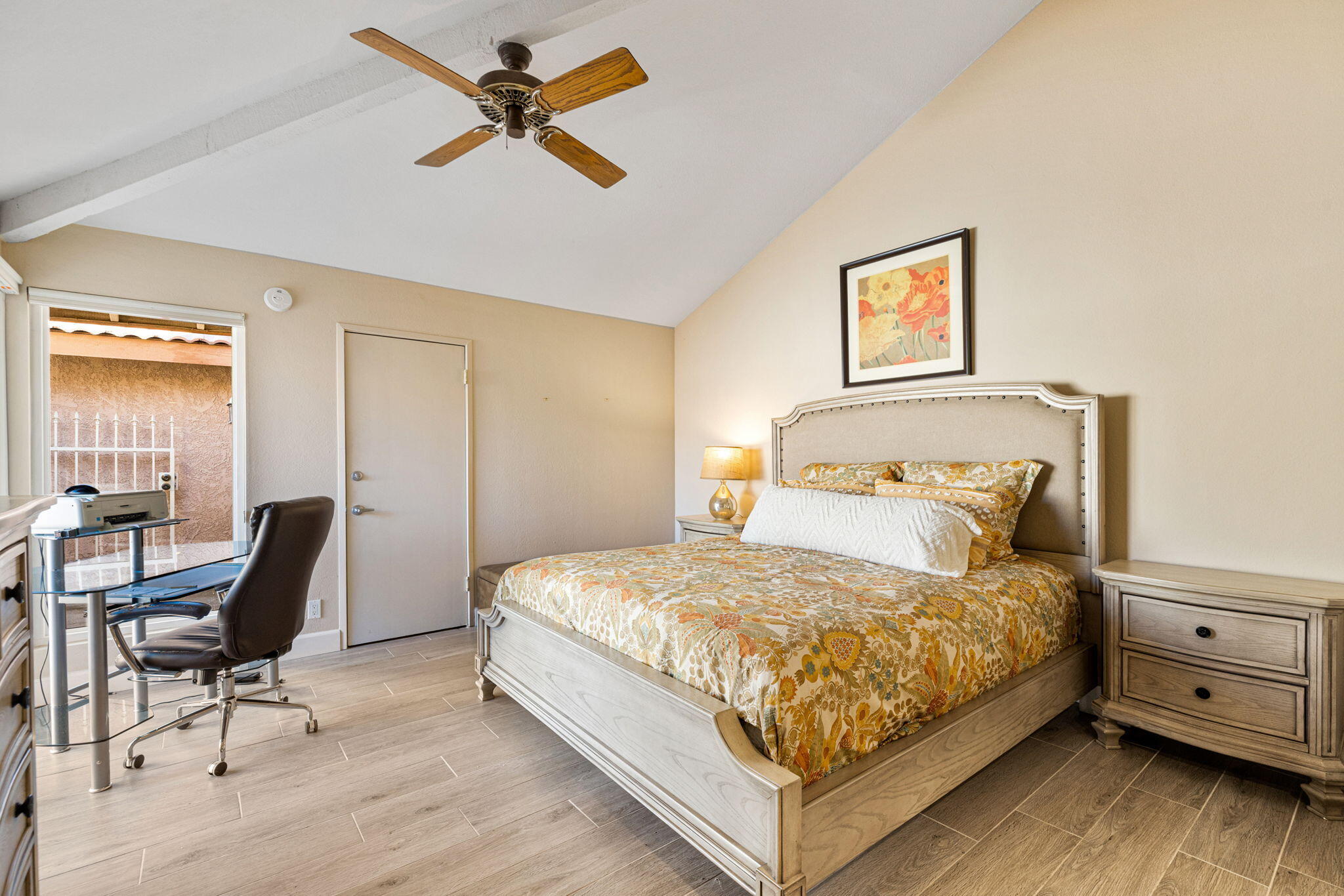 49091 Taylor Street Indio, CA 92201 - Photo 24 of 49 a bedroom with a bed and a chair in it