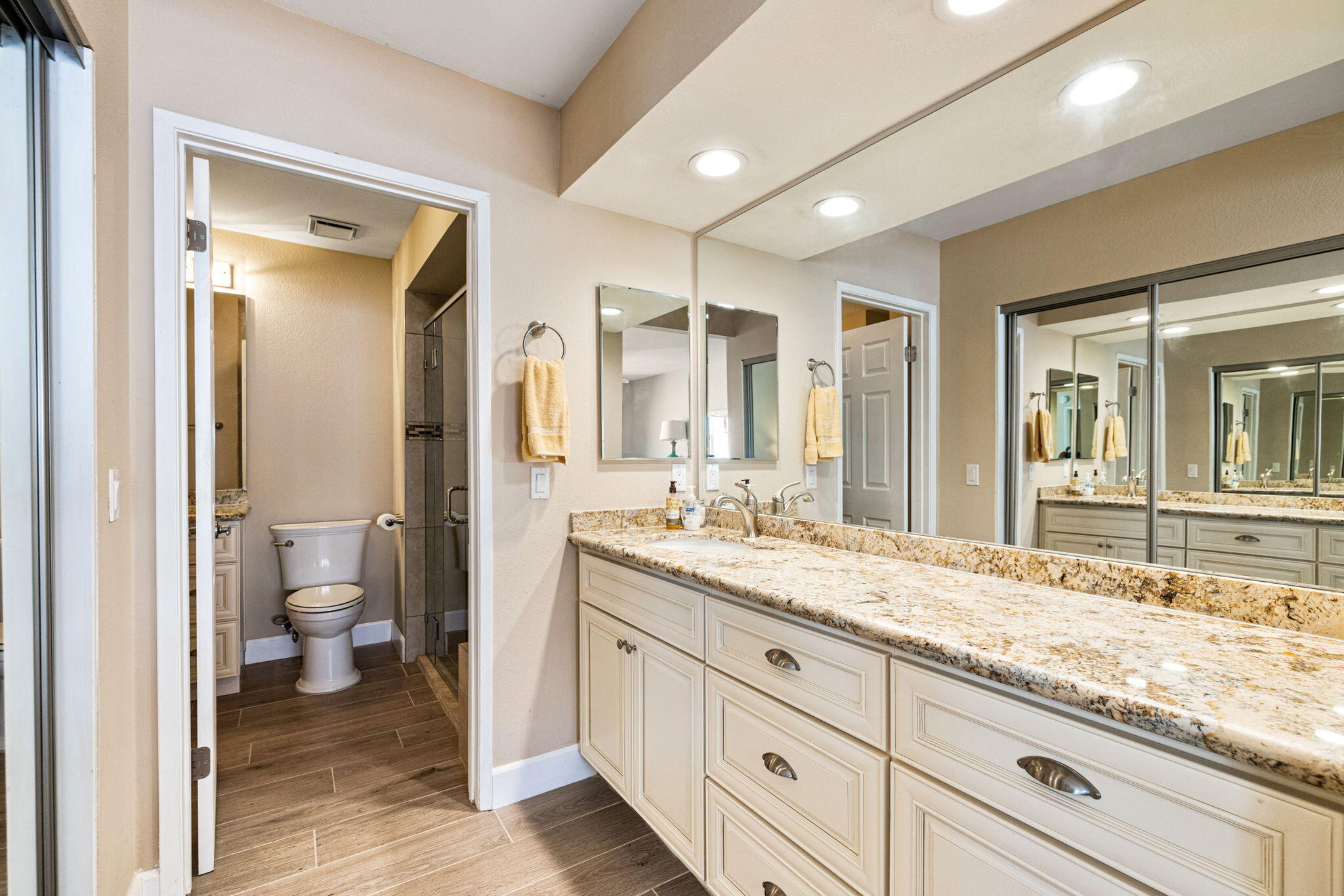 49091 Taylor Street Indio, CA 92201 - Photo 28 of 49 a bathroom with a granite countertop sink mirror and a toilet