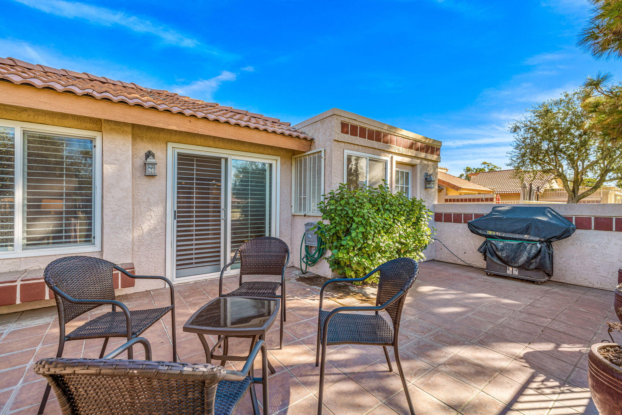 49091 Taylor Street Indio, CA 92201 - Photo 33 of 49 a balcony with furniture and a potted plant