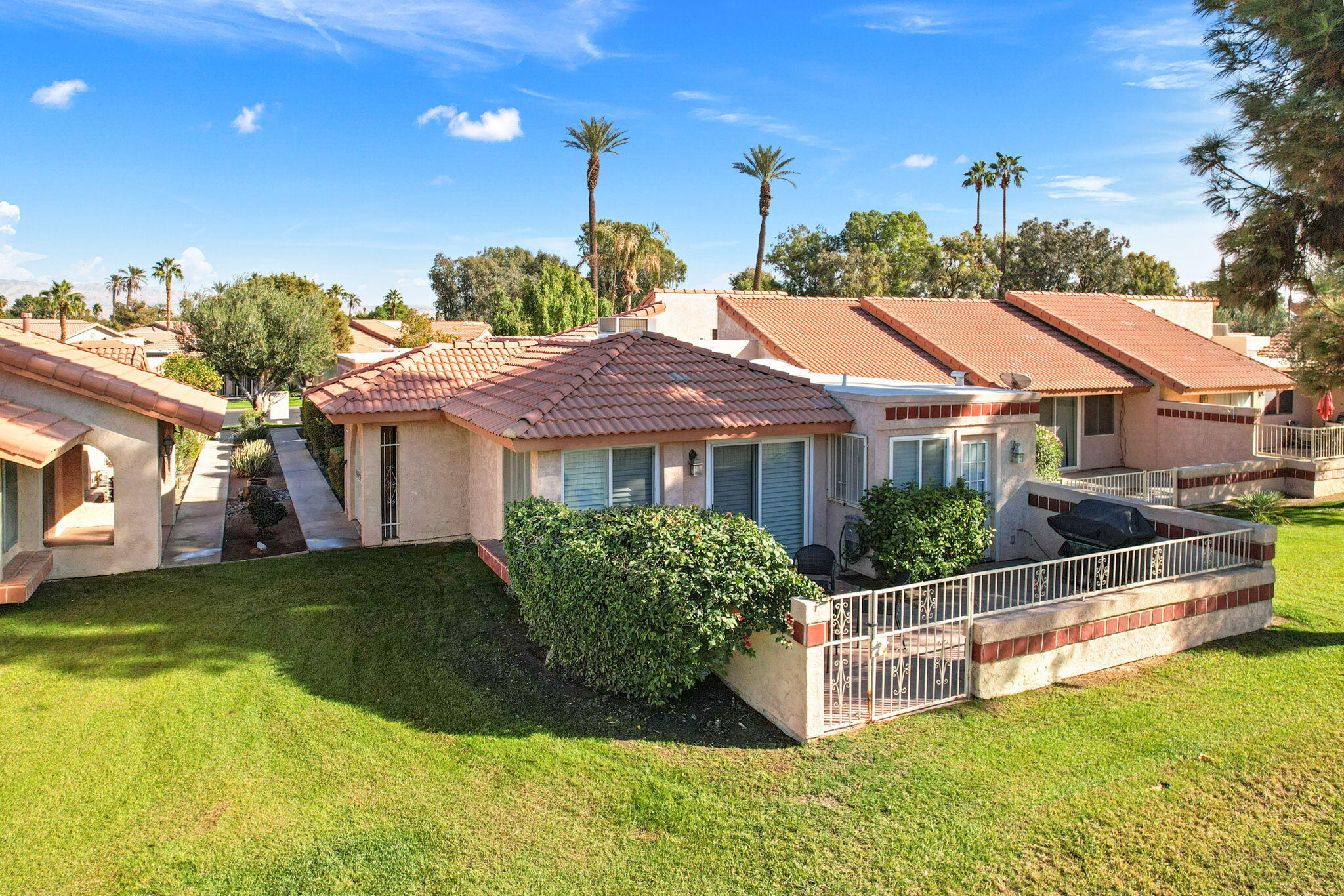 49091 Taylor Street Indio, CA 92201 - Photo 37 of 49 a front view of a house with garden