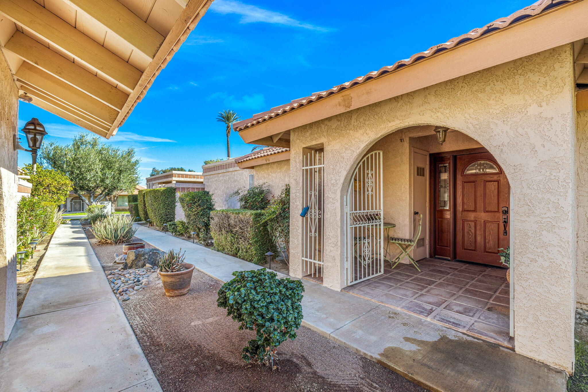 49091 Taylor Street Indio, CA 92201 - Photo 39 of 49 a view of a house with backyard and garden