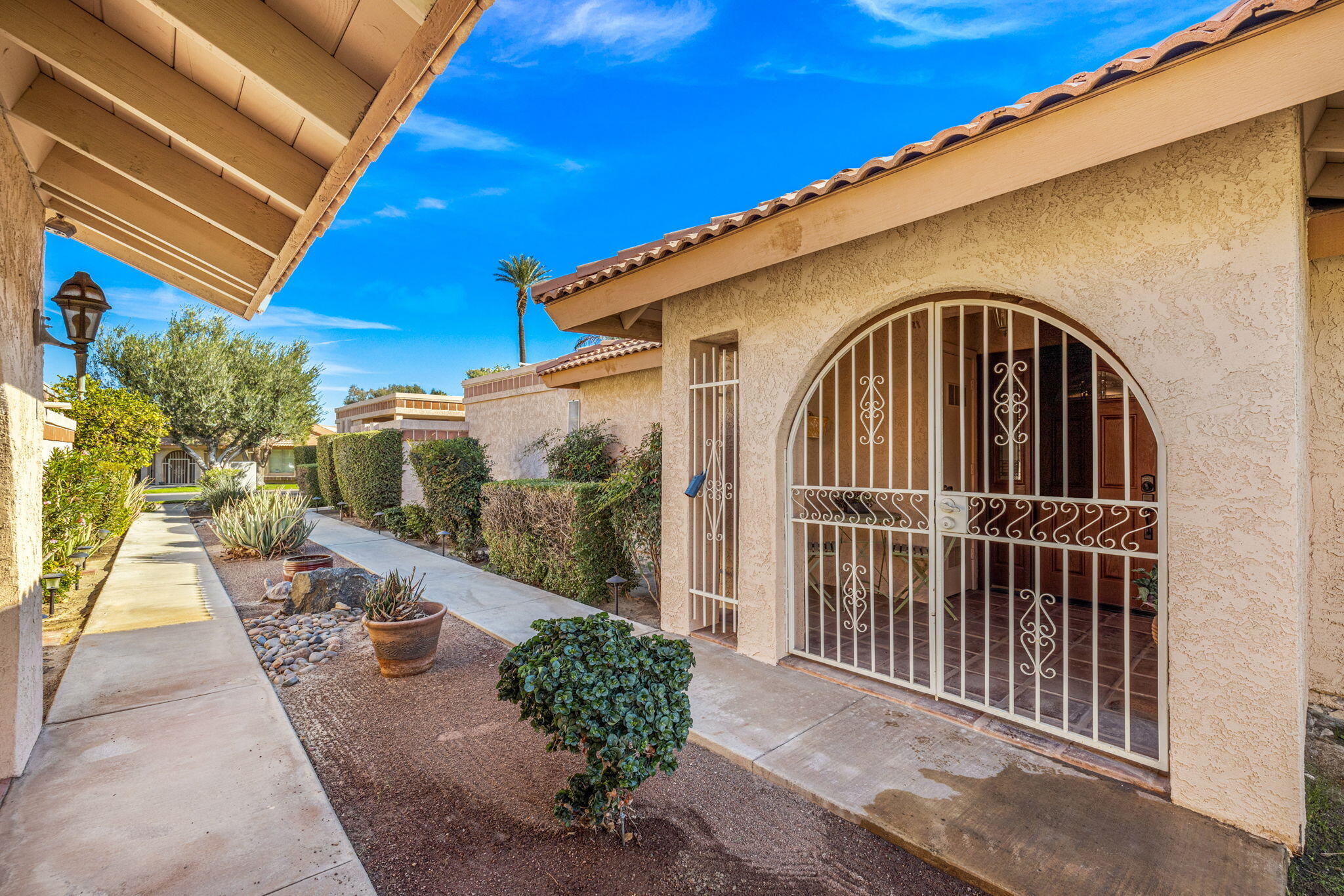 49091 Taylor Street Indio, CA 92201 - Photo 41 of 49 a view of a house with a porch