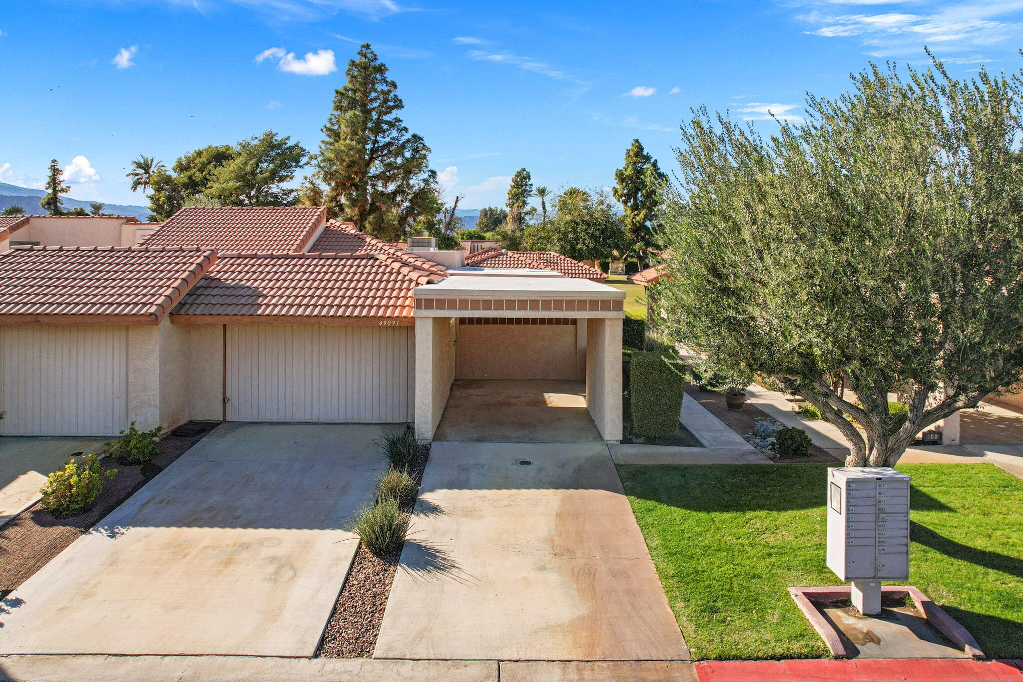 49091 Taylor Street Indio, CA 92201 - Photo 42 of 49 a front view of a house with garden