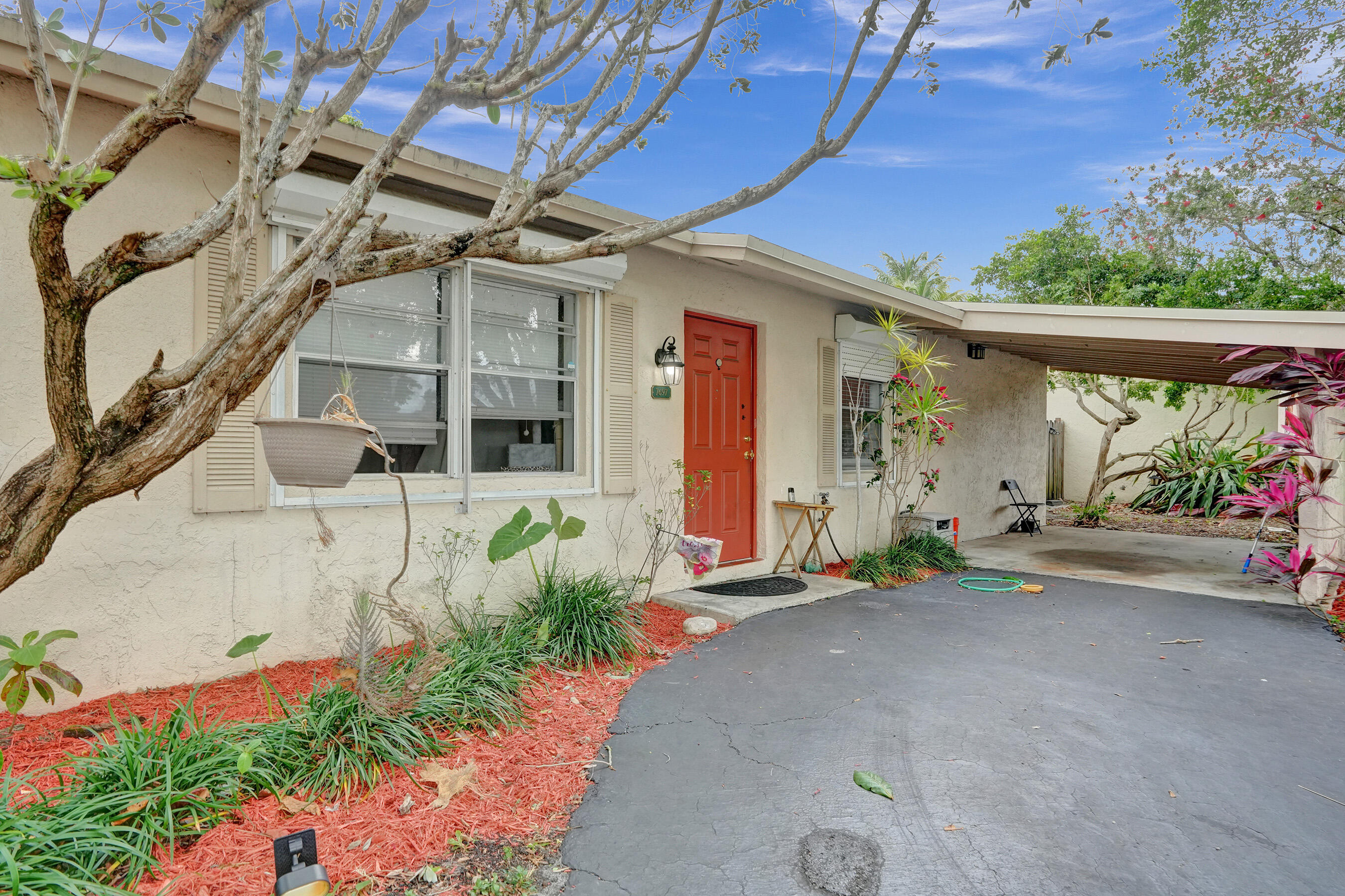 7697 Forest Boulevard North Lauderdale, FL 33068 - Photo 2 of 30 a front view of a house with a garage