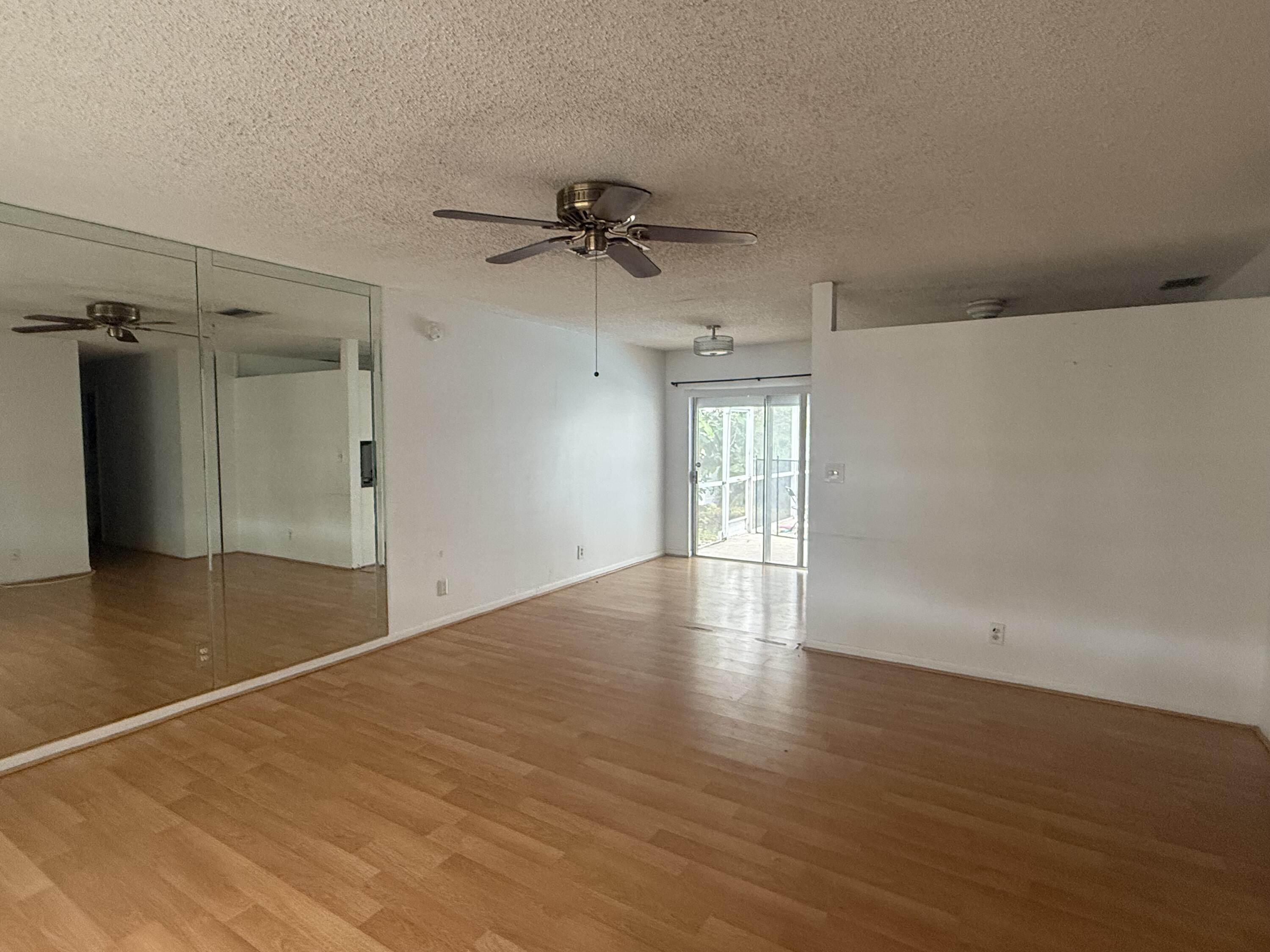 7697 Forest Boulevard North Lauderdale, FL 33068 - Photo 28 of 30 wooden floor in an empty room with a window
