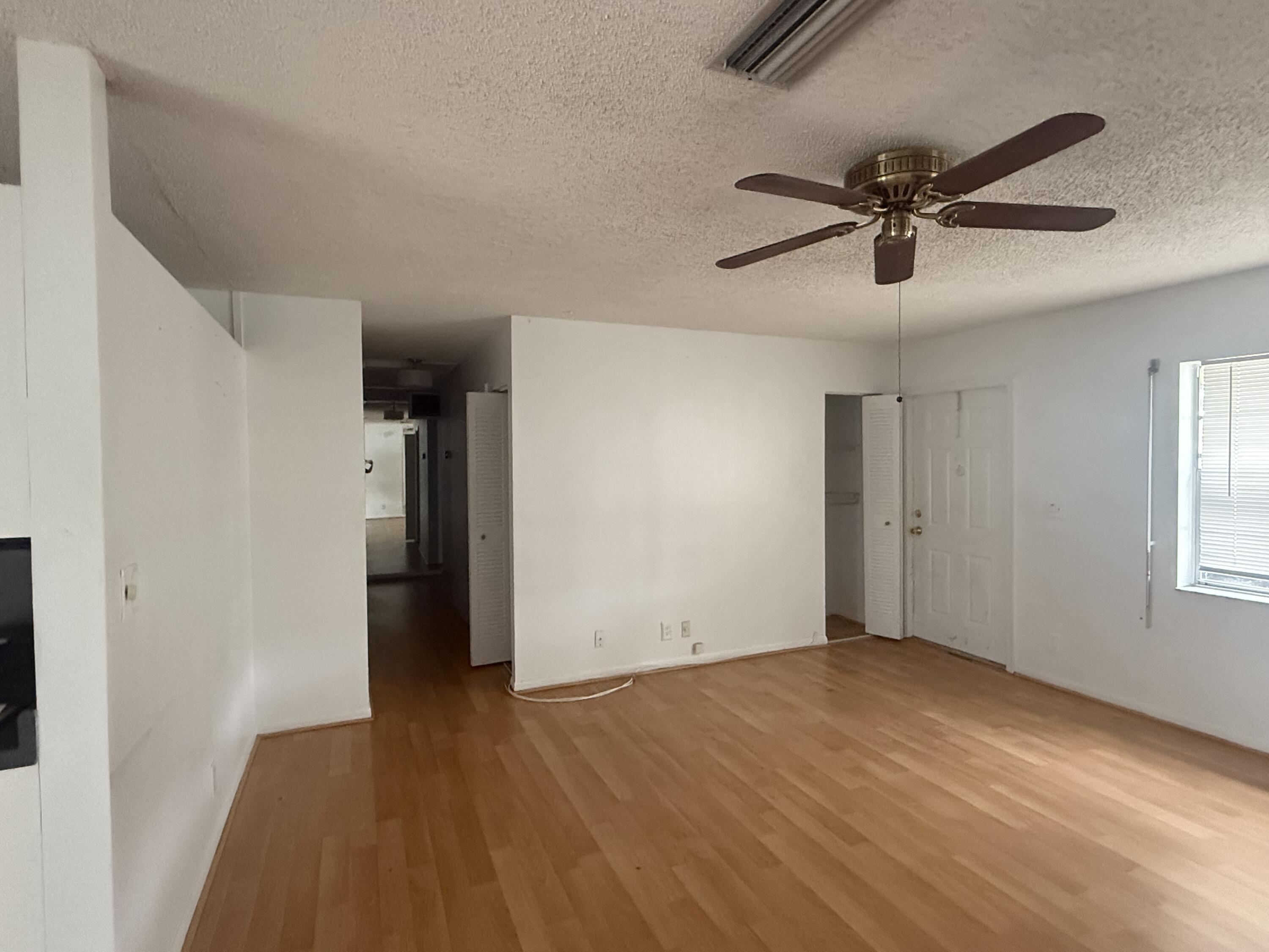 7697 Forest Boulevard North Lauderdale, FL 33068 - Photo 29 of 30 an empty room with wooden floor and windows