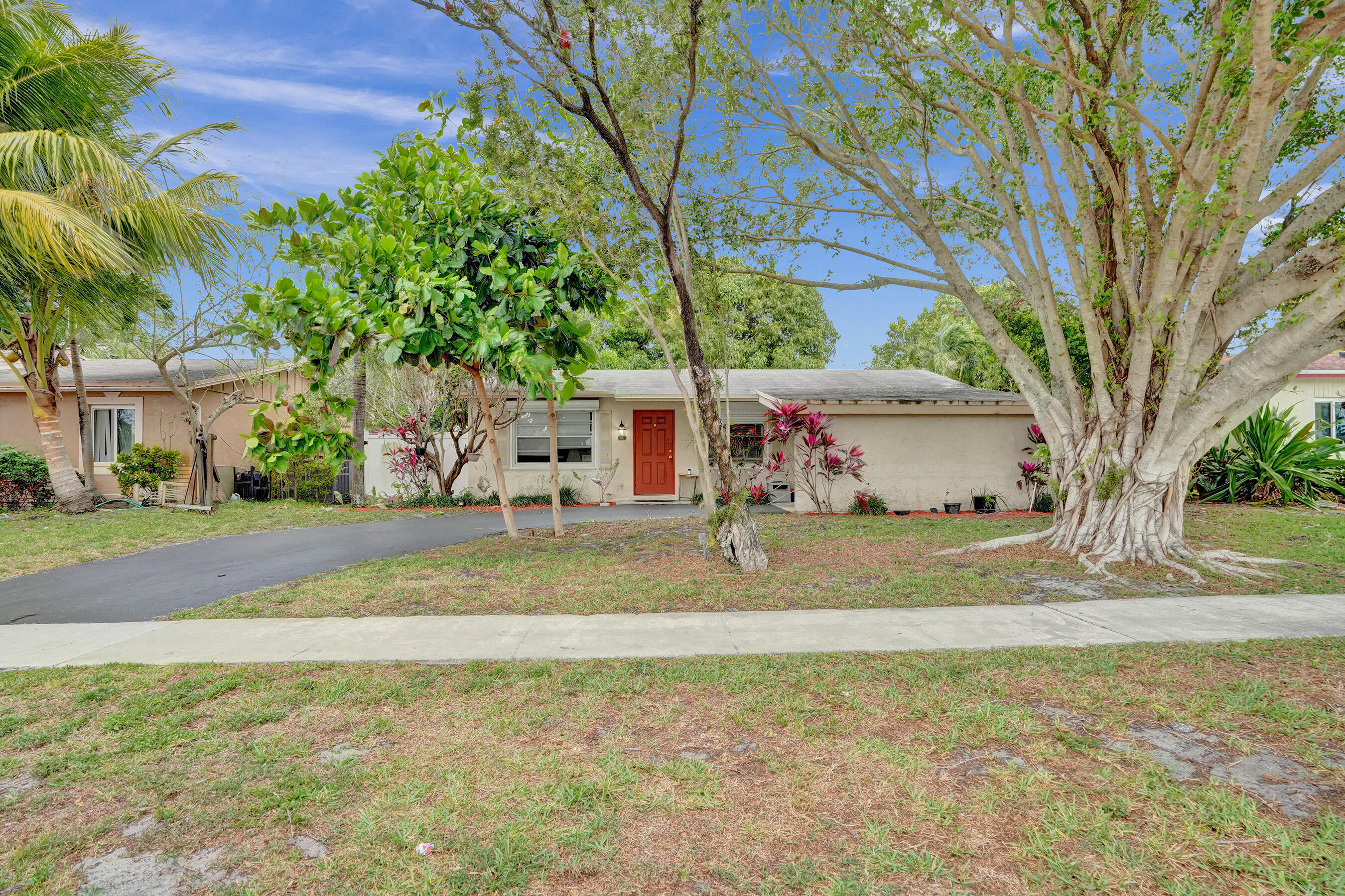 7697 Forest Boulevard North Lauderdale, FL 33068 - Photo 4 of 30 a view of a yard with yellow house