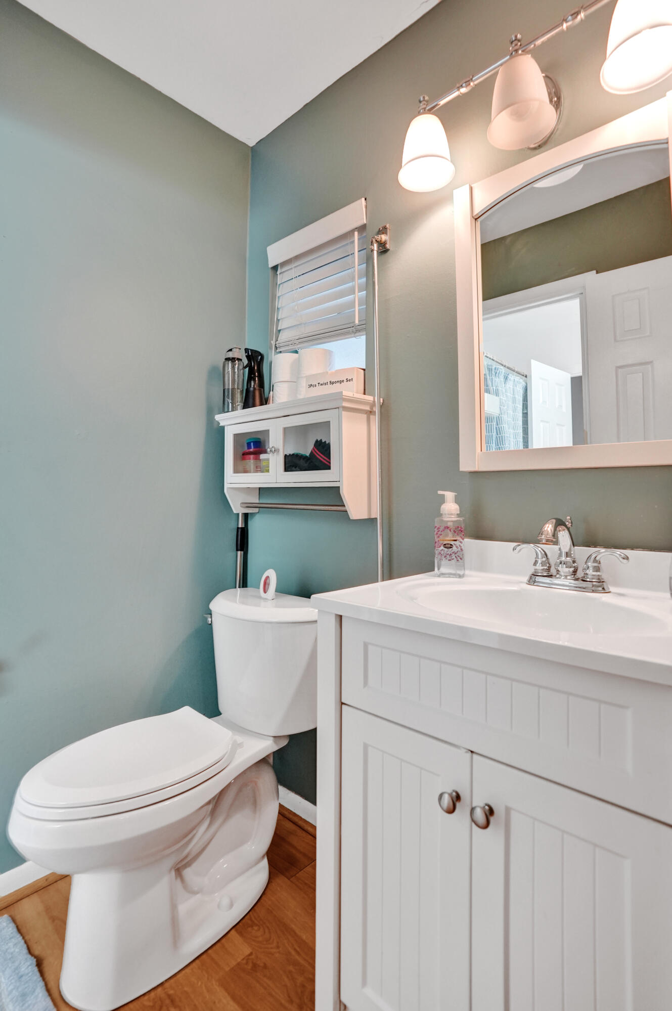 7697 Forest Boulevard North Lauderdale, FL 33068 - Photo 6 of 30 a bathroom with a sink a toilet and a mirror