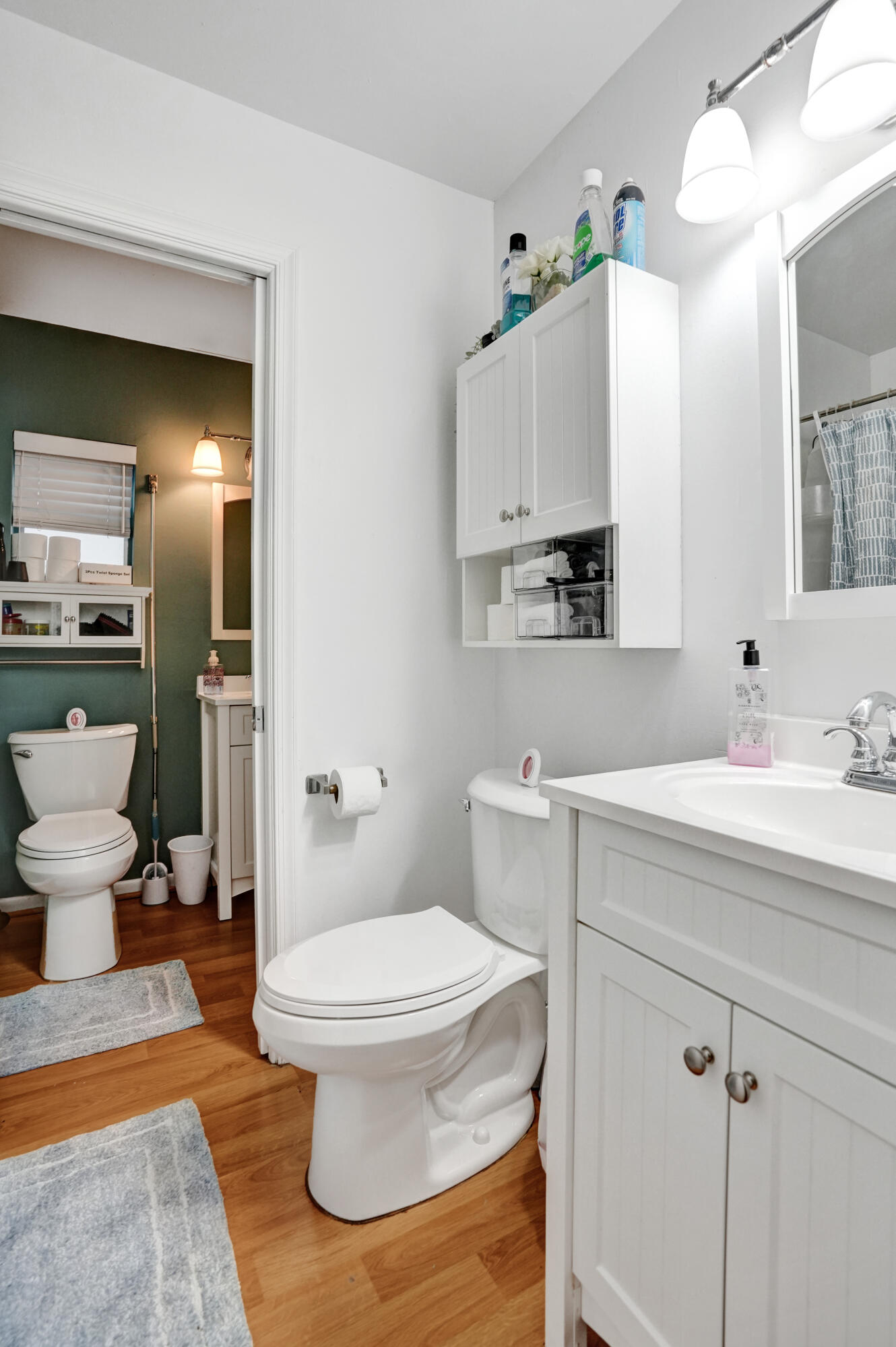 7697 Forest Boulevard North Lauderdale, FL 33068 - Photo 9 of 30 a bathroom with a sink a toilet and a mirror