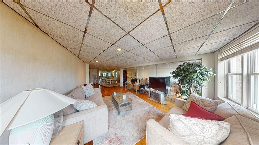 2373 Ocean Parkway, Unit 2J Brooklyn, NY 11223 - Photo 12 of 24 a living room with furniture or couch and a large window