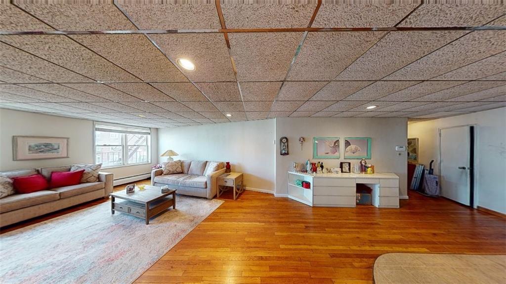 2373 Ocean Parkway, Unit 2J Brooklyn, NY 11223 - Photo 13 of 24 a living room with furniture and wooden floor