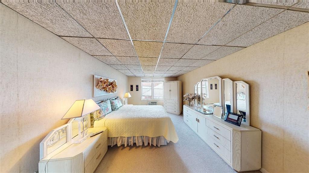 2373 Ocean Parkway, Unit 2J Brooklyn, NY 11223 - Photo 16 of 24 a spacious bedroom with a bed and a mirror