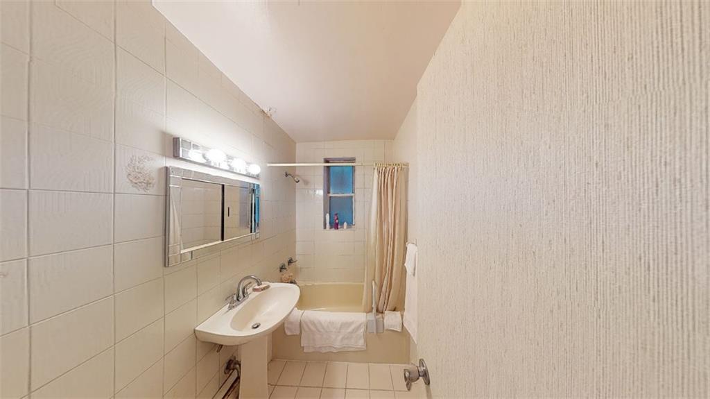 2373 Ocean Parkway, Unit 2J Brooklyn, NY 11223 - Photo 20 of 24 a bathroom with a sink and toilet