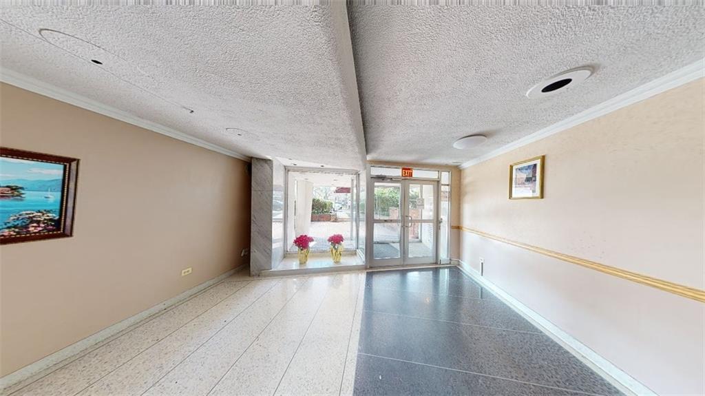 2373 Ocean Parkway, Unit 2J Brooklyn, NY 11223 - Photo 2 of 24 a view of an empty room with window and wooden floor