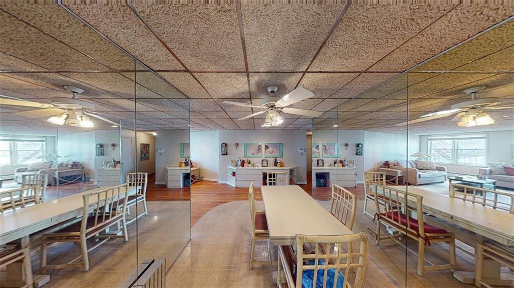 2373 Ocean Parkway, Unit 2J Brooklyn, NY 11223 - Photo 9 of 24 a room with lots of table chair and wooden floors
