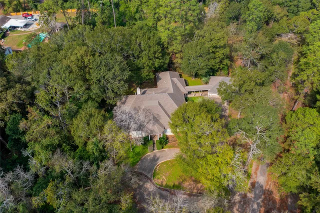 a view of a garden with a house