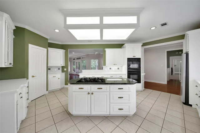 a large bathroom with a large mirror vanity and a shower