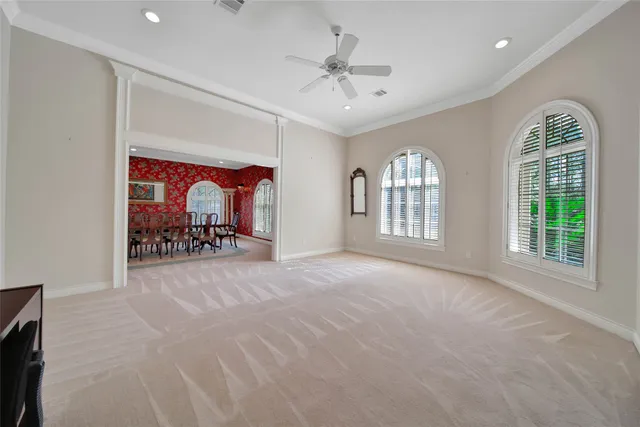 a view of livingroom with hardwood floor and a ceiling fan