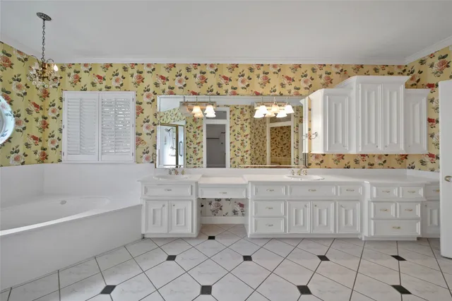 a bathroom with a bathtub sink and mirror