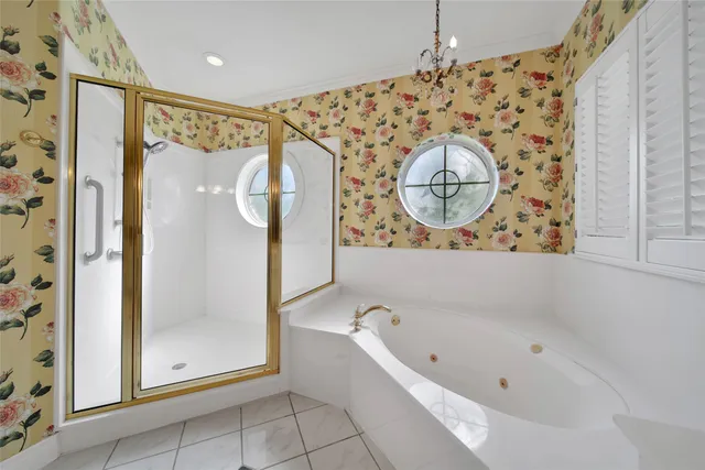 a bathroom with a bathtub and a shower