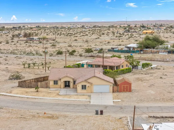 a view of a house with a snow in the yard