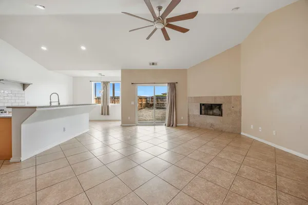 a view of a kitchen with a sink and a stove top oven