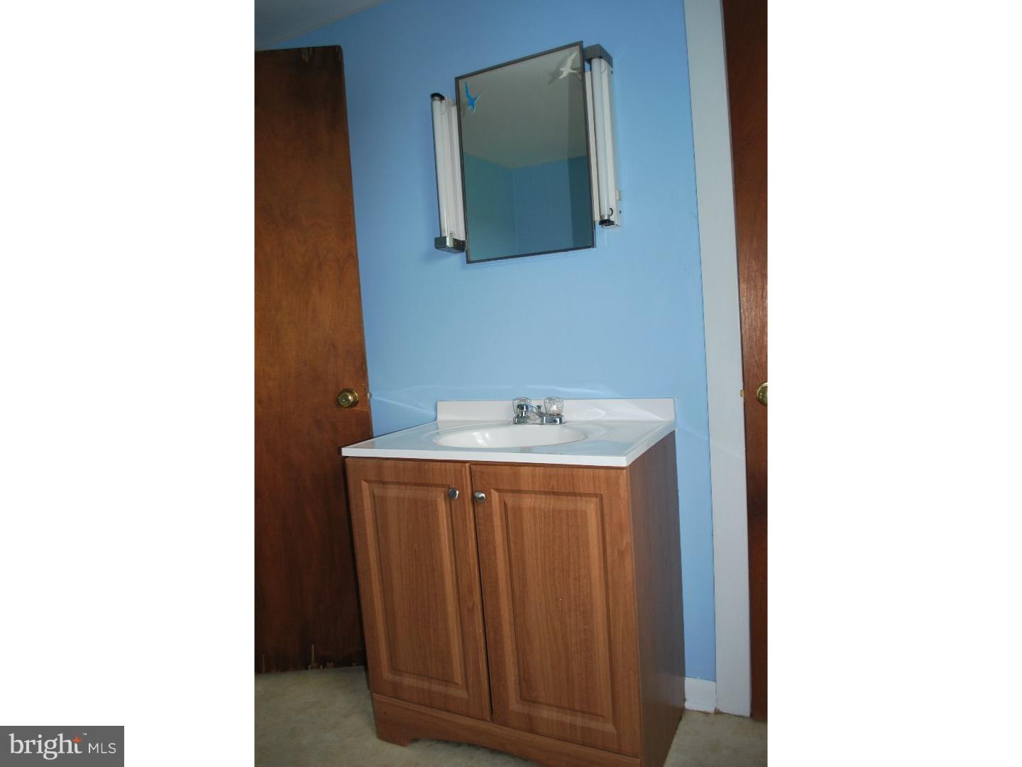 643 Blake Road Elkton, MD 21921 - Photo 14 of 15 a kitchen with a sink and a cabinet