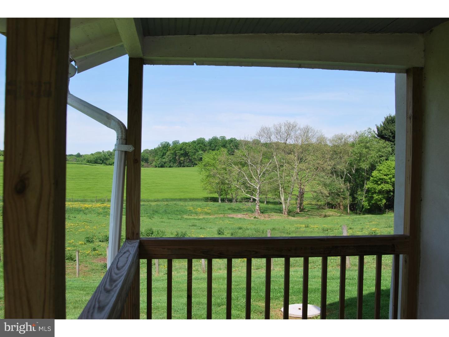 643 Blake Road Elkton, MD 21921 - Photo 6 of 15 a view of a porch with a floor to ceiling window and a yard