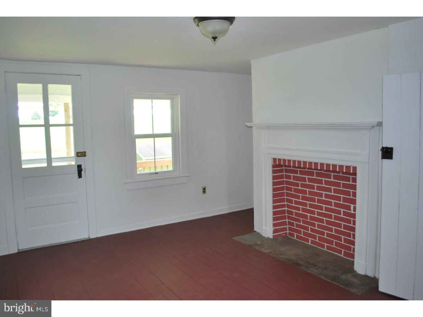 643 Blake Road Elkton, MD 21921 - Photo 7 of 15 a view of an empty room with wooden floor and a window