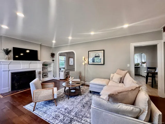 a living room with furniture or couch and a fireplace