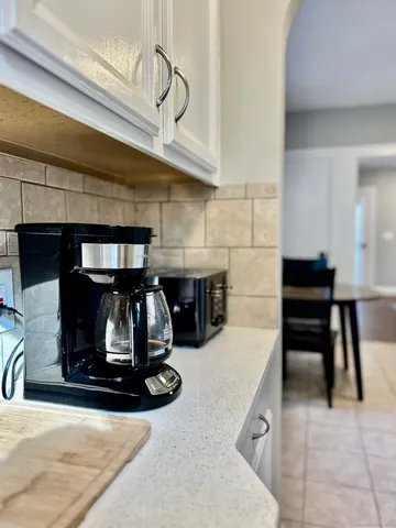 a kitchen with a stove and cabinets