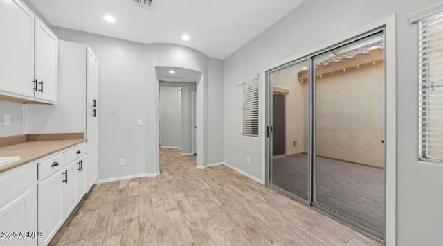 a bathroom with a shower and a sink
